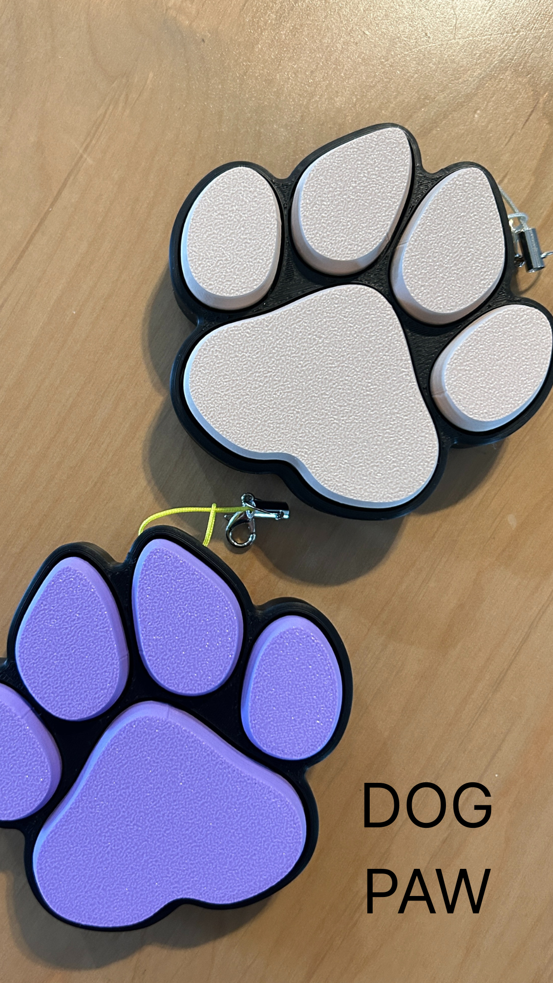 Beige and Purple Pet Paw Fidget clicker desk toys.