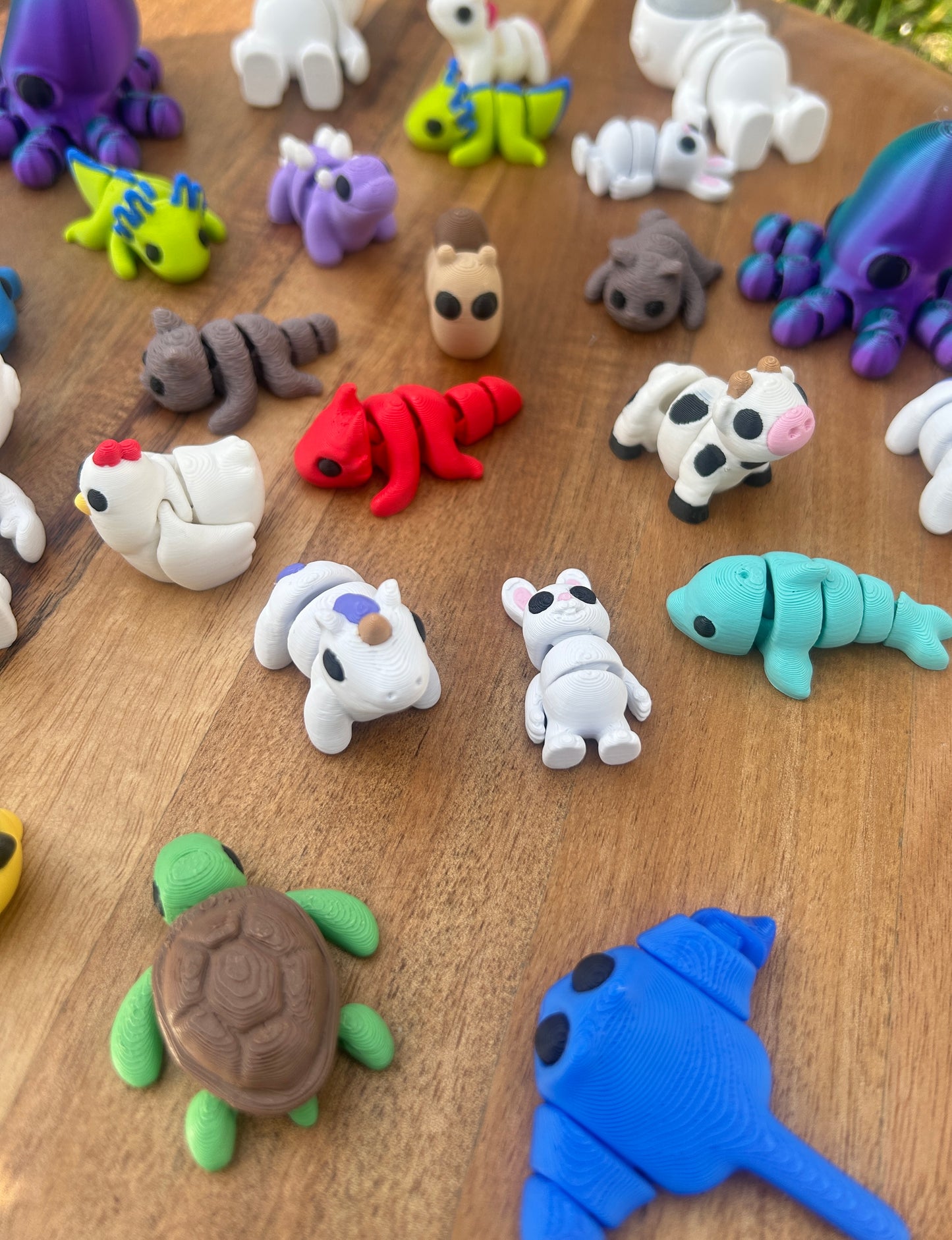 Colorful collection of 3D Printed Mini Critters from PLAground Shop.